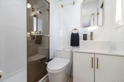 a bedroom with furniture and a wooden floor