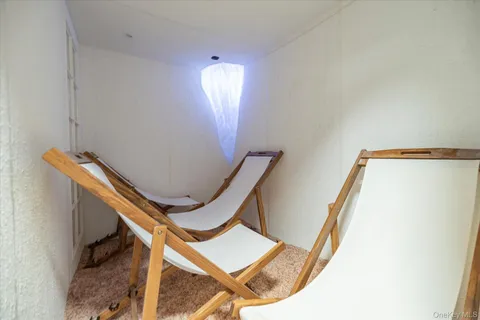 a view of a patio with a table and chairs