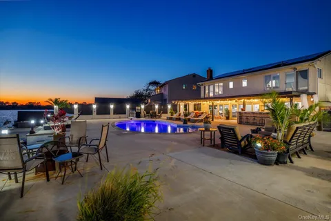 a view of outdoor space with seating area and barbeque oven