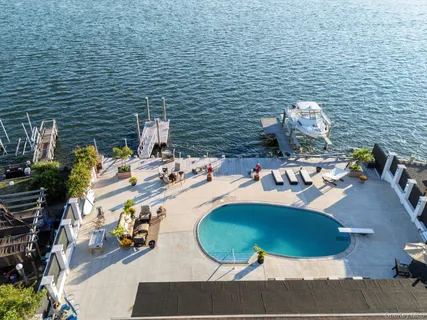 a view of swimming pool with outdoor seating