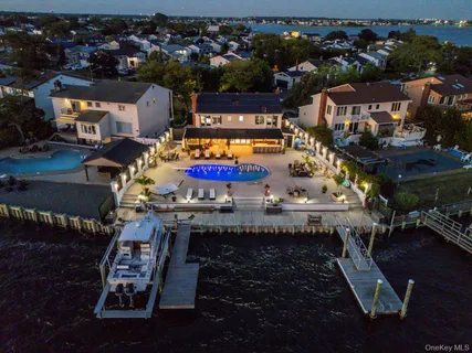 a swimming pool with outdoor seating