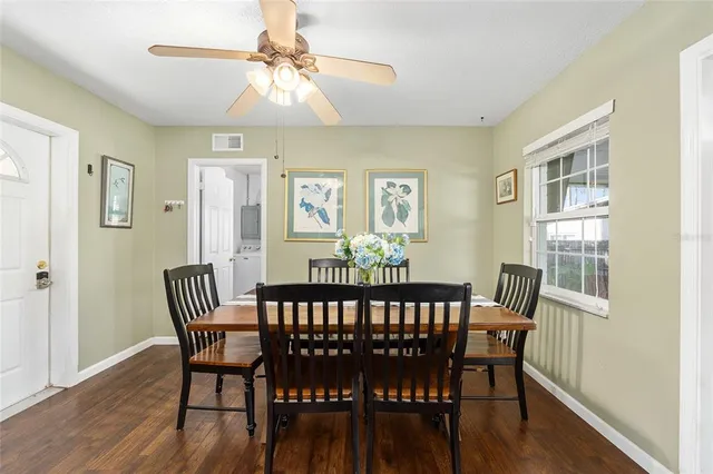 a view of a dining room with furniture window and wooden floor