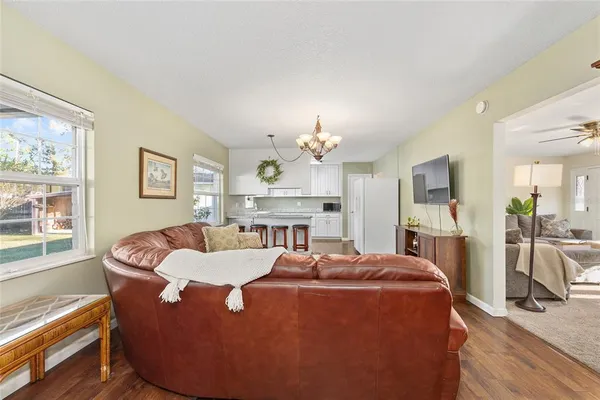 a bed room with furniture and a chandelier