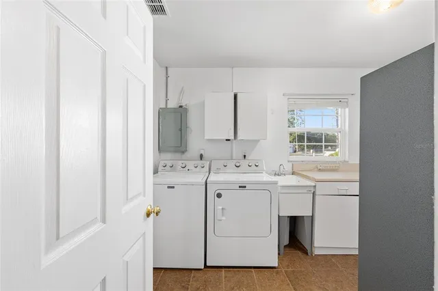 a view of bathroom with dual sinks