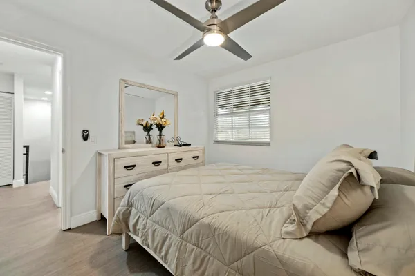 a bedroom with a bed and window
