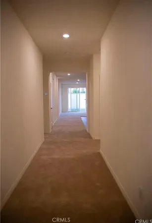a view of hallway and hall with a window