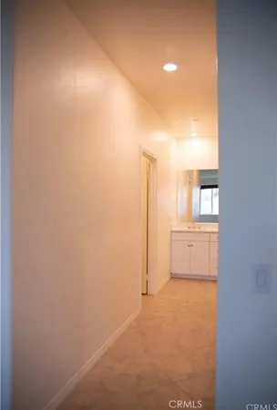 a view of a room with cabinet and windows