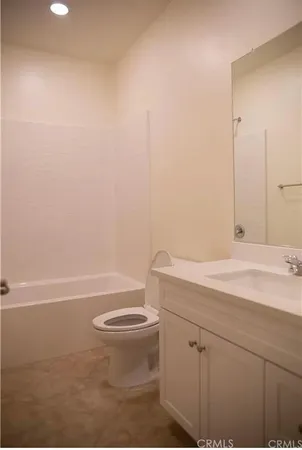 a bathroom with a sink a toilet and a bathtub