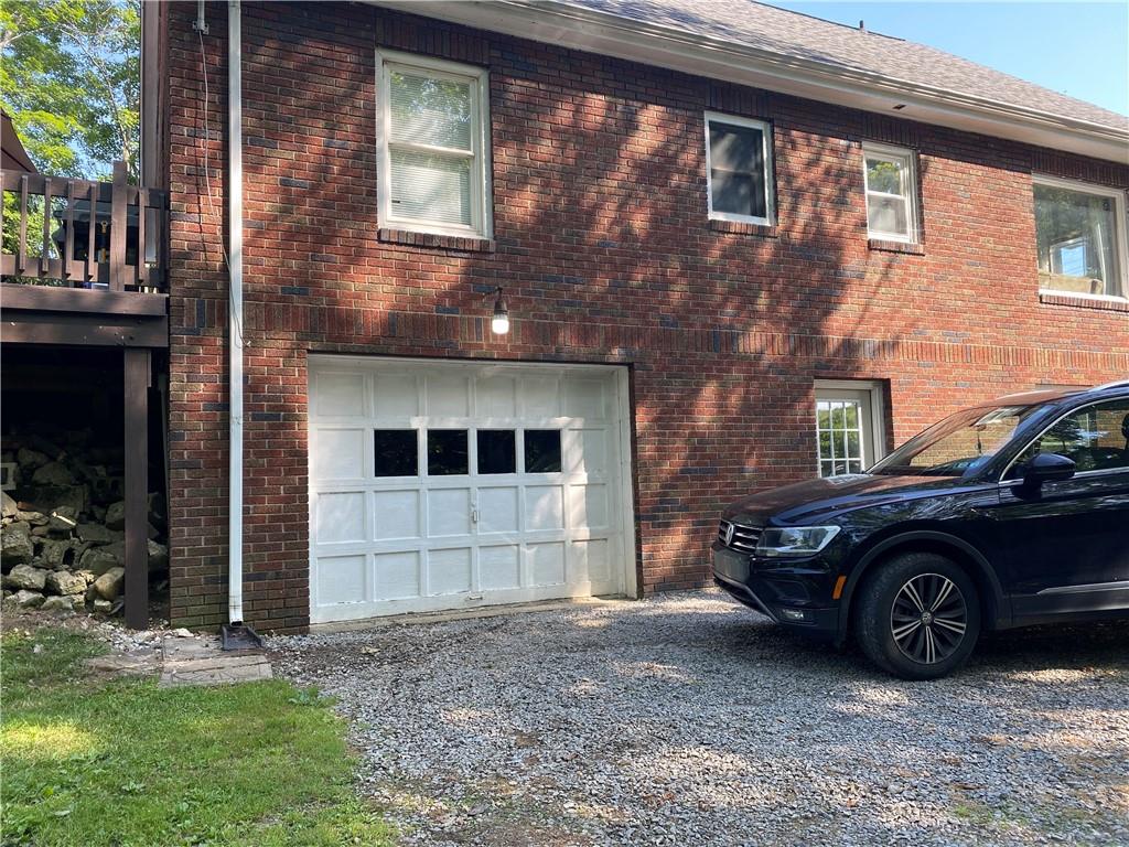 881 Mercer Road Greenville, PA 16125 - Photo 3 of 19 a view of a car in front of a brick house