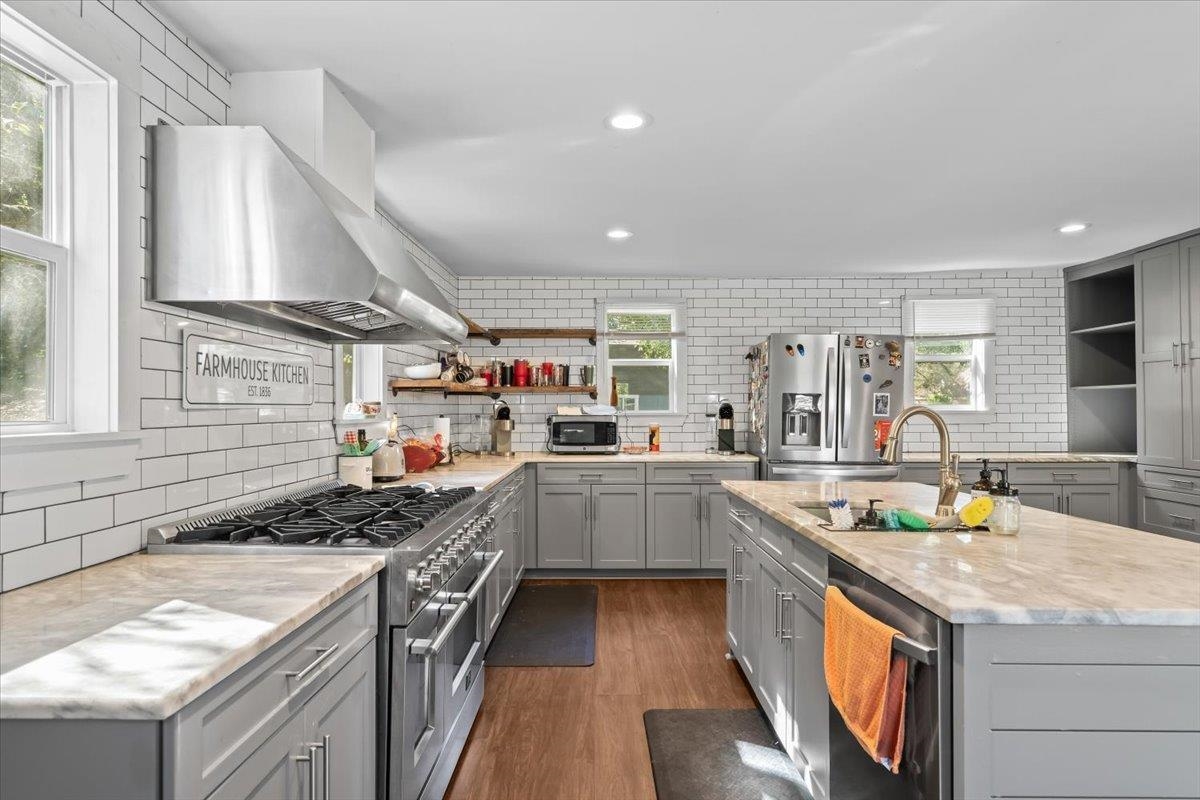 9301 Osborn Road Arlington, TN 38002 - Photo 11 of 31 a kitchen with a sink stove and cabinets
