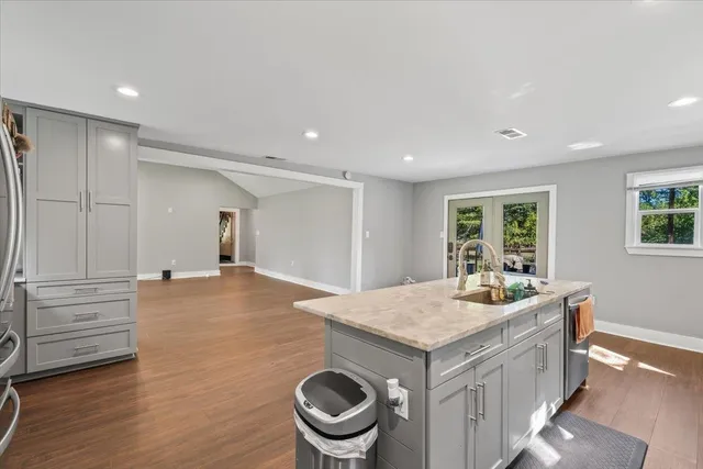 an aerial view of a house with a yard lake and mountain view