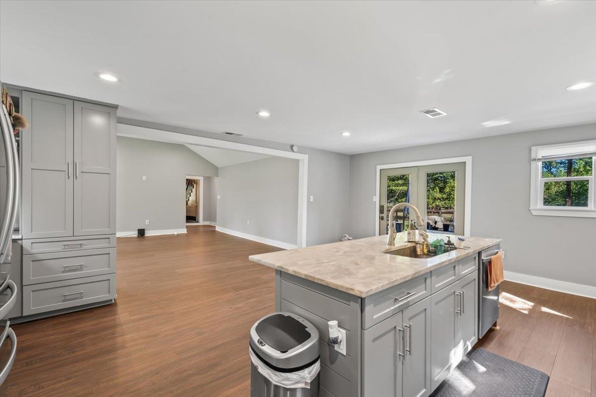 9301 Osborn Road Arlington, TN 38002 - Photo 31 of 31 a living room with a sink and dishwasher with wooden floor