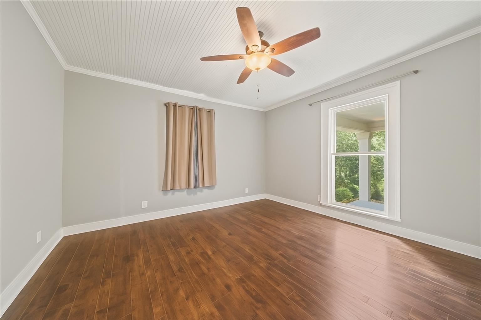 9301 Osborn Road Arlington, TN 38002 - Photo 13 of 31 a view of an empty room with wooden floor and a window
