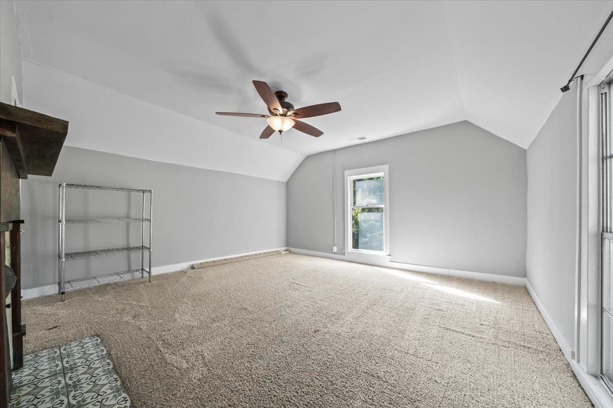 9301 Osborn Road Arlington, TN 38002 - Photo 19 of 31 a view of a livingroom with a ceiling fan and wooden floor
