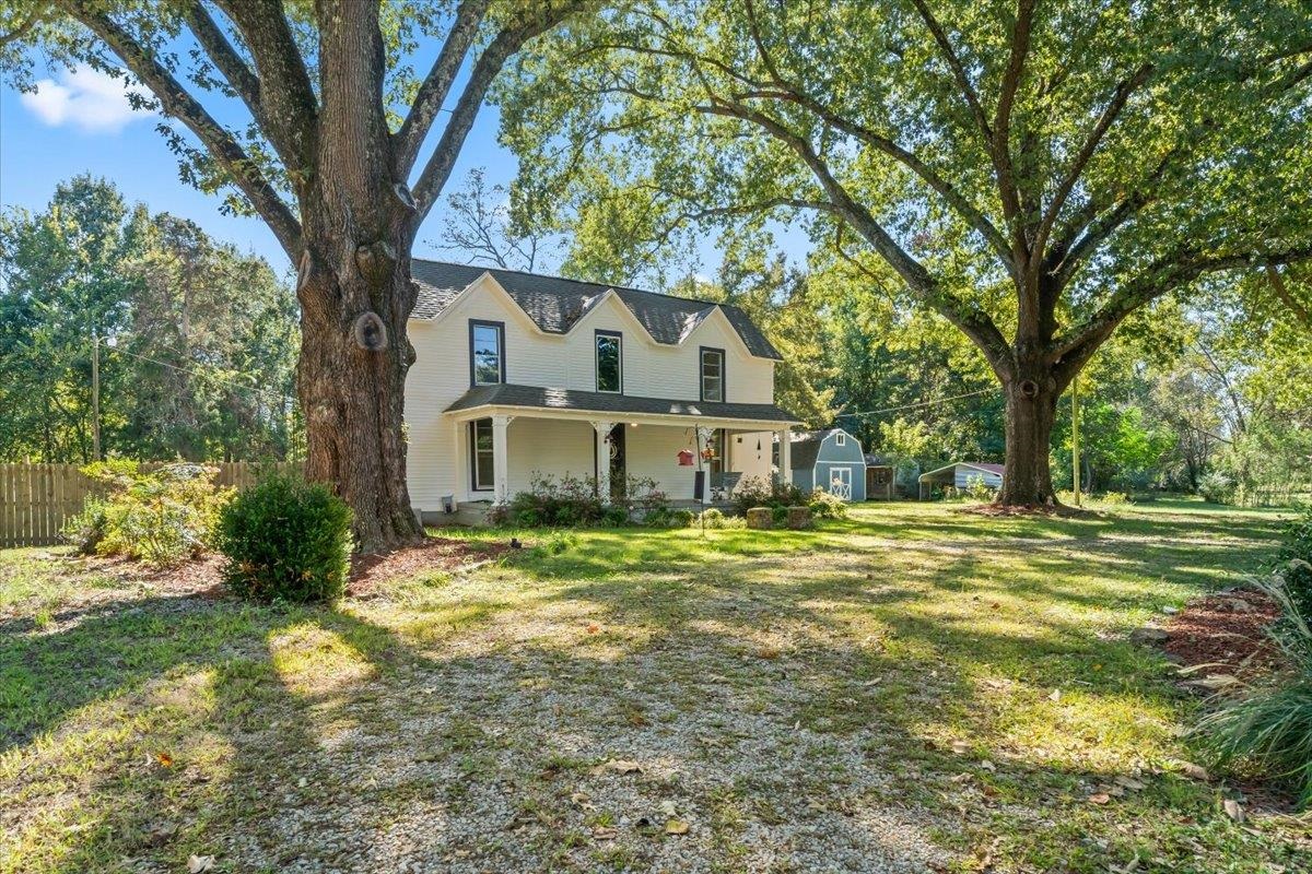 9301 Osborn Road Arlington, TN 38002 - Photo 2 of 31 a front view of a house with a yard
