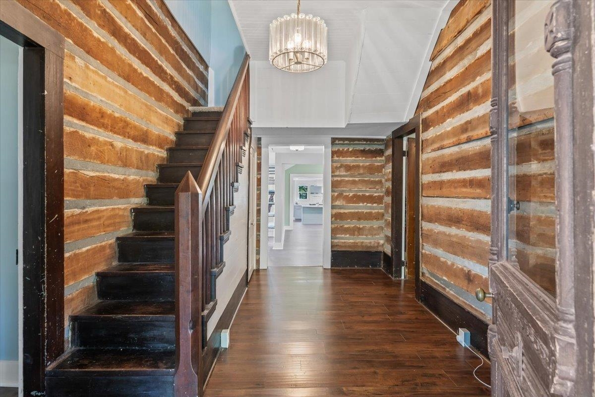 9301 Osborn Road Arlington, TN 38002 - Photo 6 of 31 a view of staircase with white walls and wooden floor