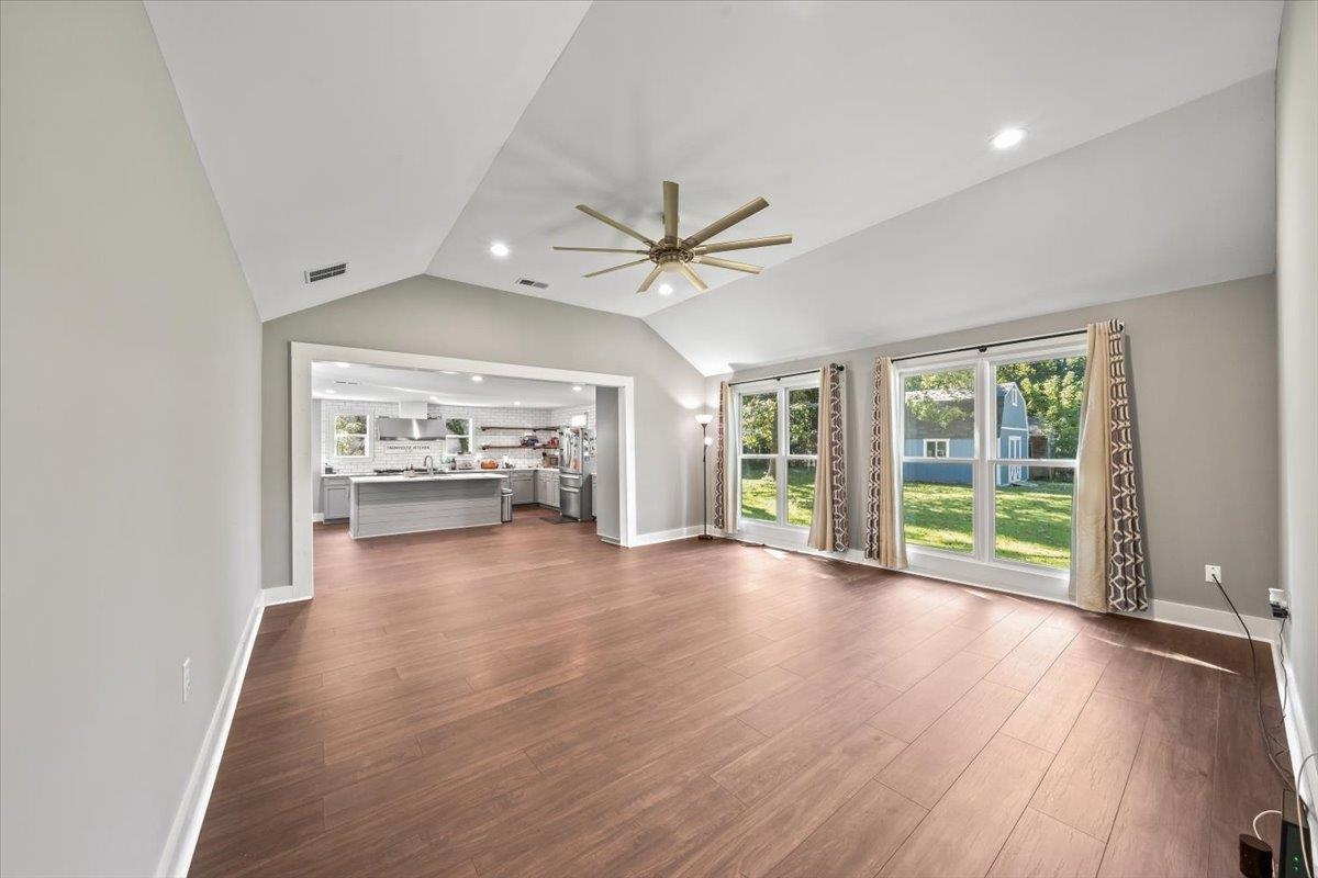 9301 Osborn Road Arlington, TN 38002 - Photo 7 of 31 a view of n empty room with window and wooden floor