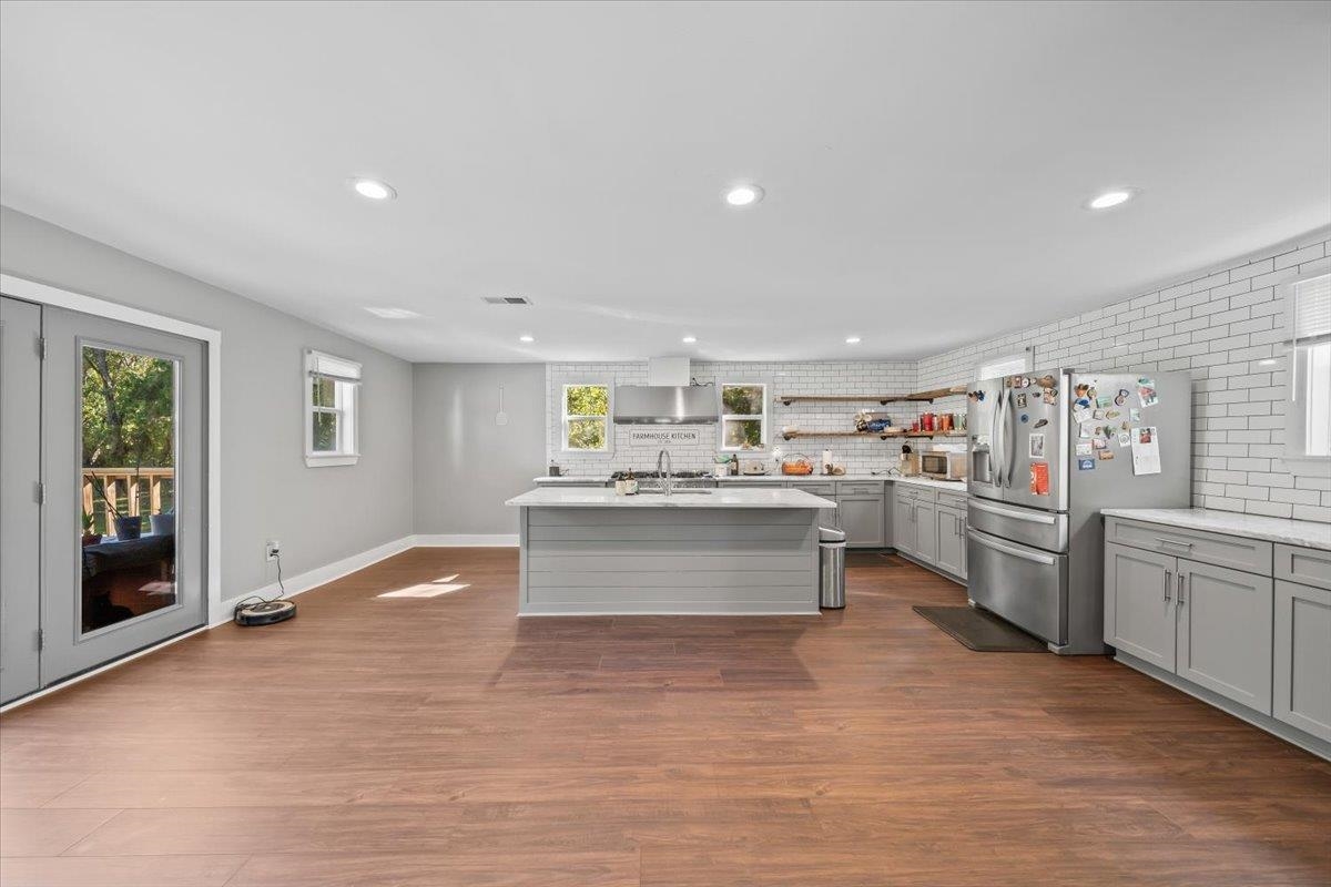 9301 Osborn Road Arlington, TN 38002 - Photo 9 of 31 a view of kitchen with stainless steel appliances kitchen island granite countertop a stove top oven a sink a dining table and chairs