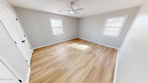 a view of empty room with windows