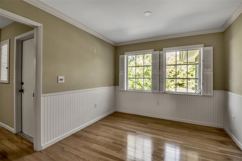 509 Spoonbill Way Sarasota, FL 34236 - Photo 19 of 86 a view of empty room with wooden floor and fan
