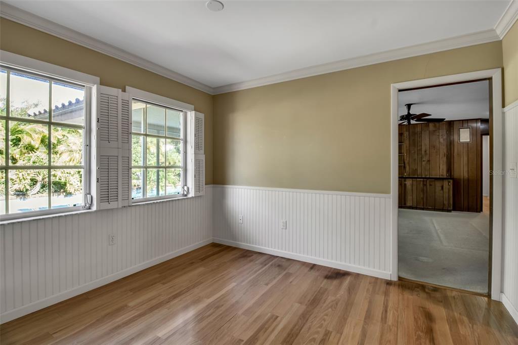 509 Spoonbill Way Sarasota, FL 34236 - Photo 20 of 86 an empty room with wooden floor and windows