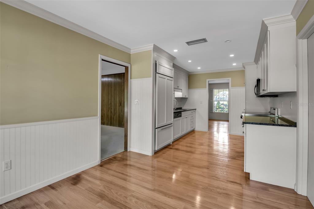 509 Spoonbill Way Sarasota, FL 34236 - Photo 21 of 86 a view of a kitchen with a refrigerator a stove top oven a sink and dishwasher