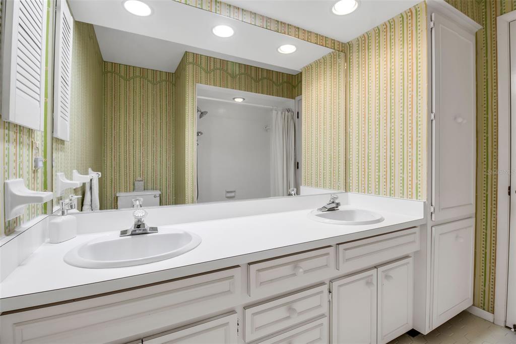 509 Spoonbill Way Sarasota, FL 34236 - Photo 35 of 86 a bathroom with a sink and a mirror