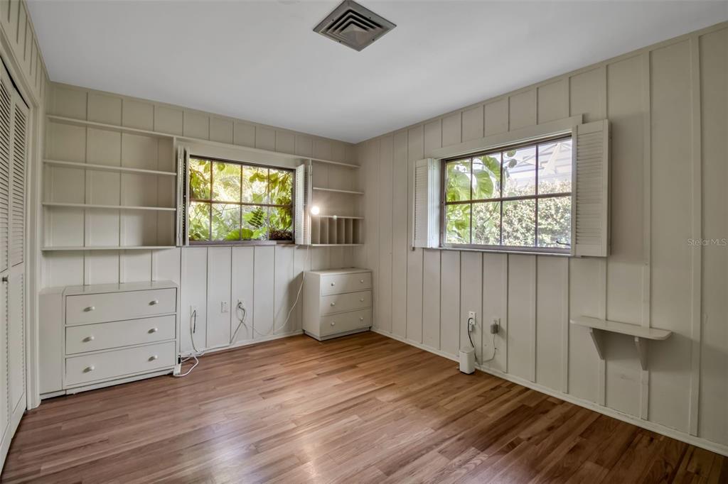 509 Spoonbill Way Sarasota, FL 34236 - Photo 39 of 86 a view of an empty room with a window and wooden floor