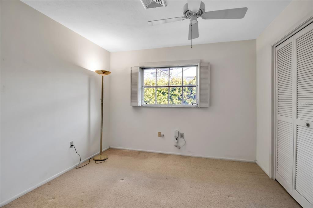 509 Spoonbill Way Sarasota, FL 34236 - Photo 42 of 86 an empty room with windows and ceiling fan