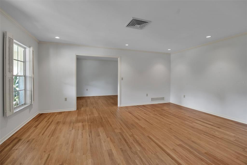 509 Spoonbill Way Sarasota, FL 34236 - Photo 7 of 86 wooden floor in an empty room with a window