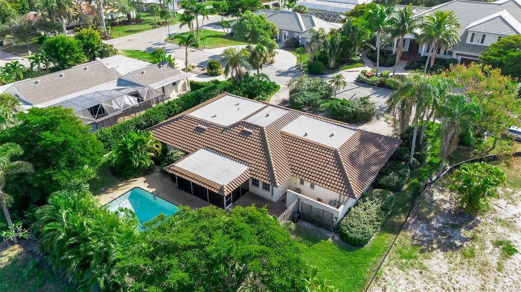 509 Spoonbill Way Sarasota, FL 34236 - Photo 71 of 86 an aerial view of a house with a garden and plants