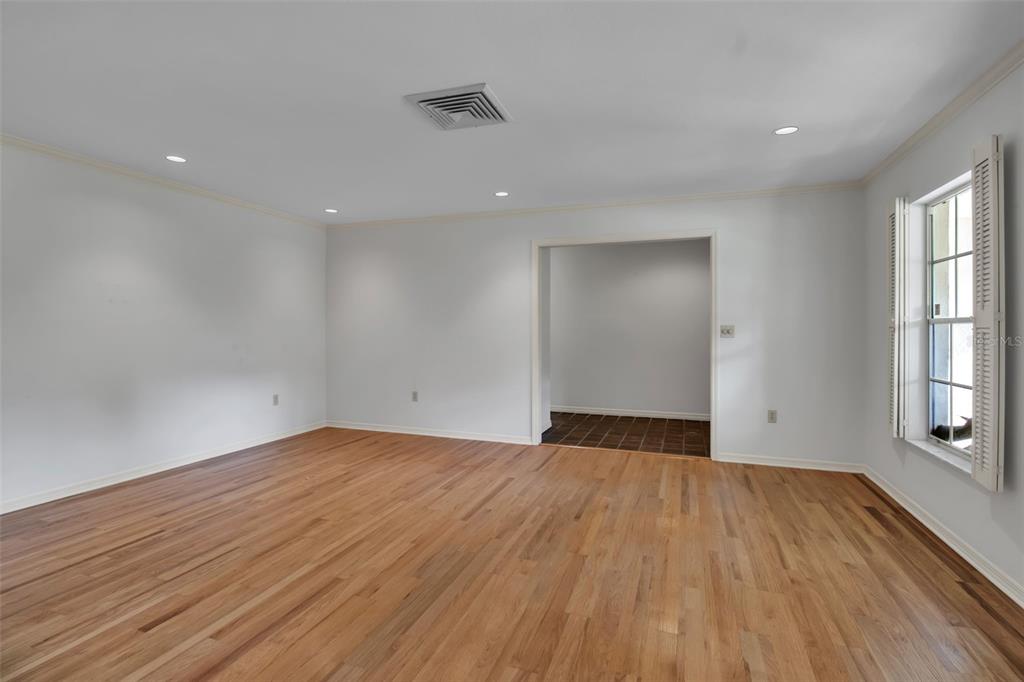 509 Spoonbill Way Sarasota, FL 34236 - Photo 8 of 86 wooden floor in an empty room with a window