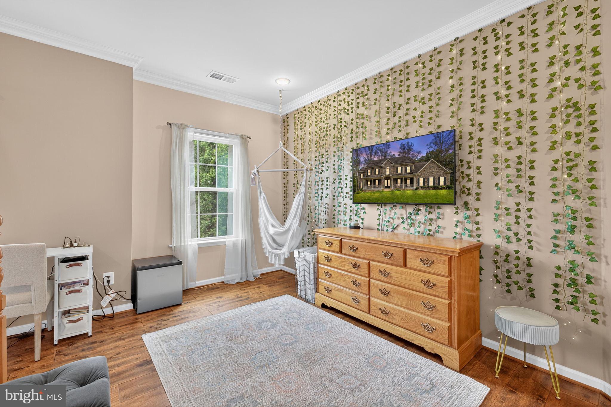 22011 Beaverdam Drive Ashburn, VA 20148 - Photo 101 of 106 a bed room with a bed and a chair