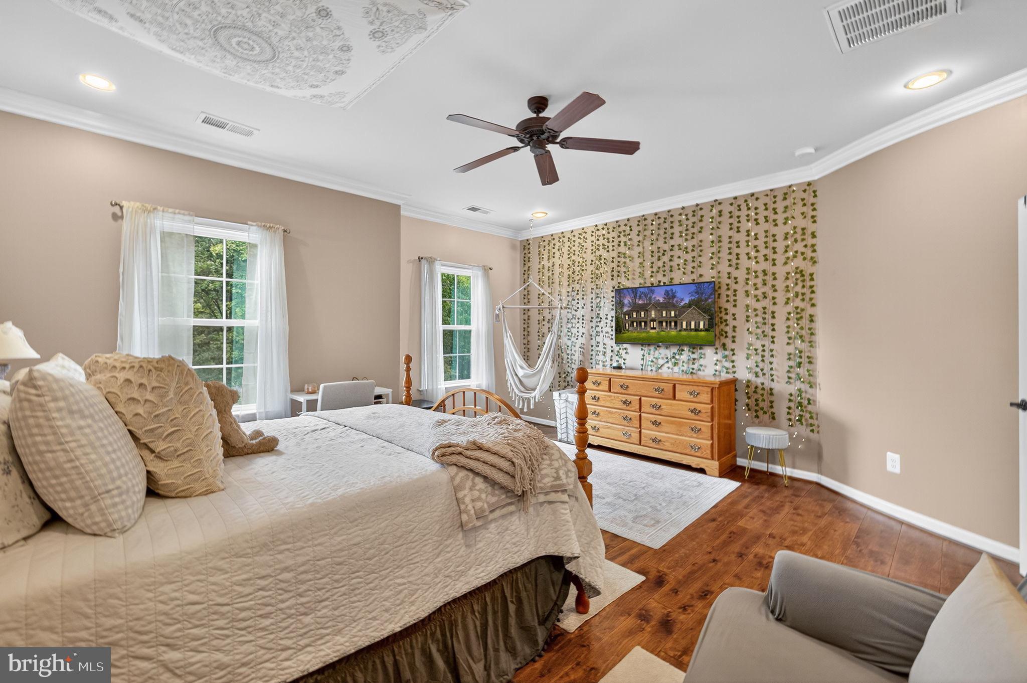 22011 Beaverdam Drive Ashburn, VA 20148 - Photo 102 of 106 Serene bedroom with elegant decor and light.