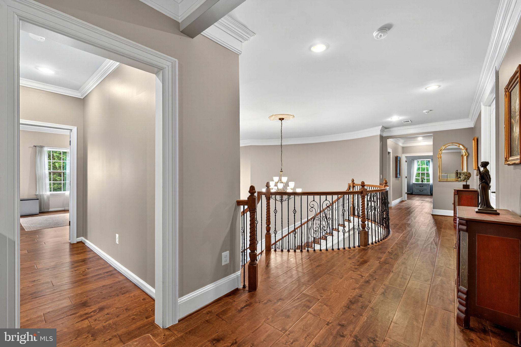 22011 Beaverdam Drive Ashburn, VA 20148 - Photo 103 of 106 a view of a hallway with wooden floor and windows