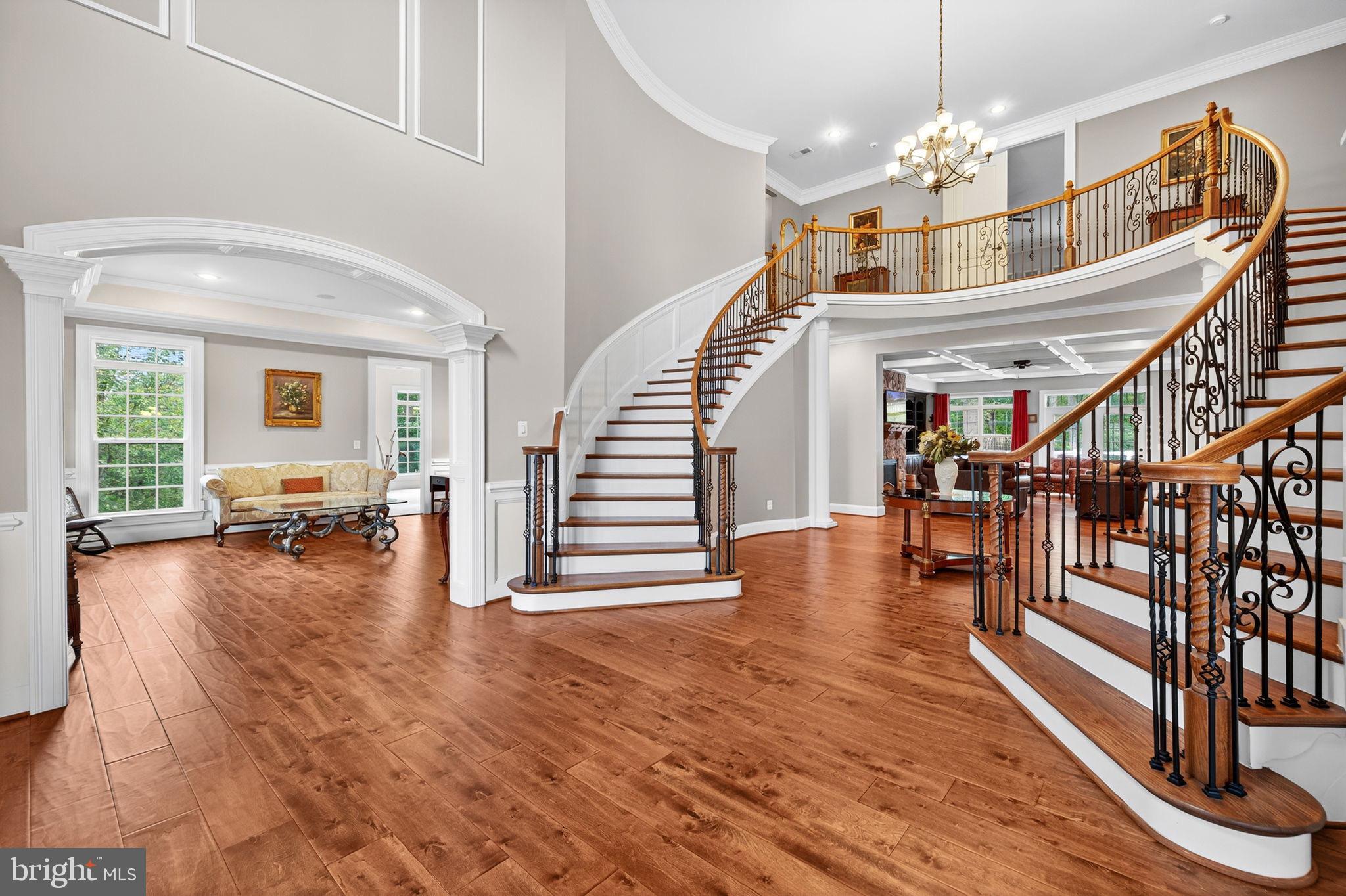 22011 Beaverdam Drive Ashburn, VA 20148 - Photo 14 of 106 Elegant foyer with grand staircase allure.