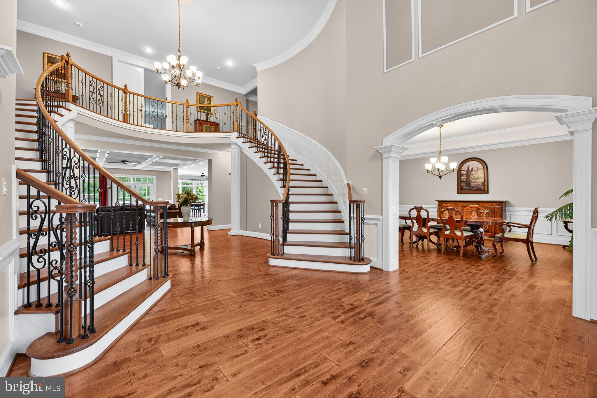 22011 Beaverdam Drive Ashburn, VA 20148 - Photo 15 of 106 a view of a livingroom and dining room with furniture wooden floor and a chandelier