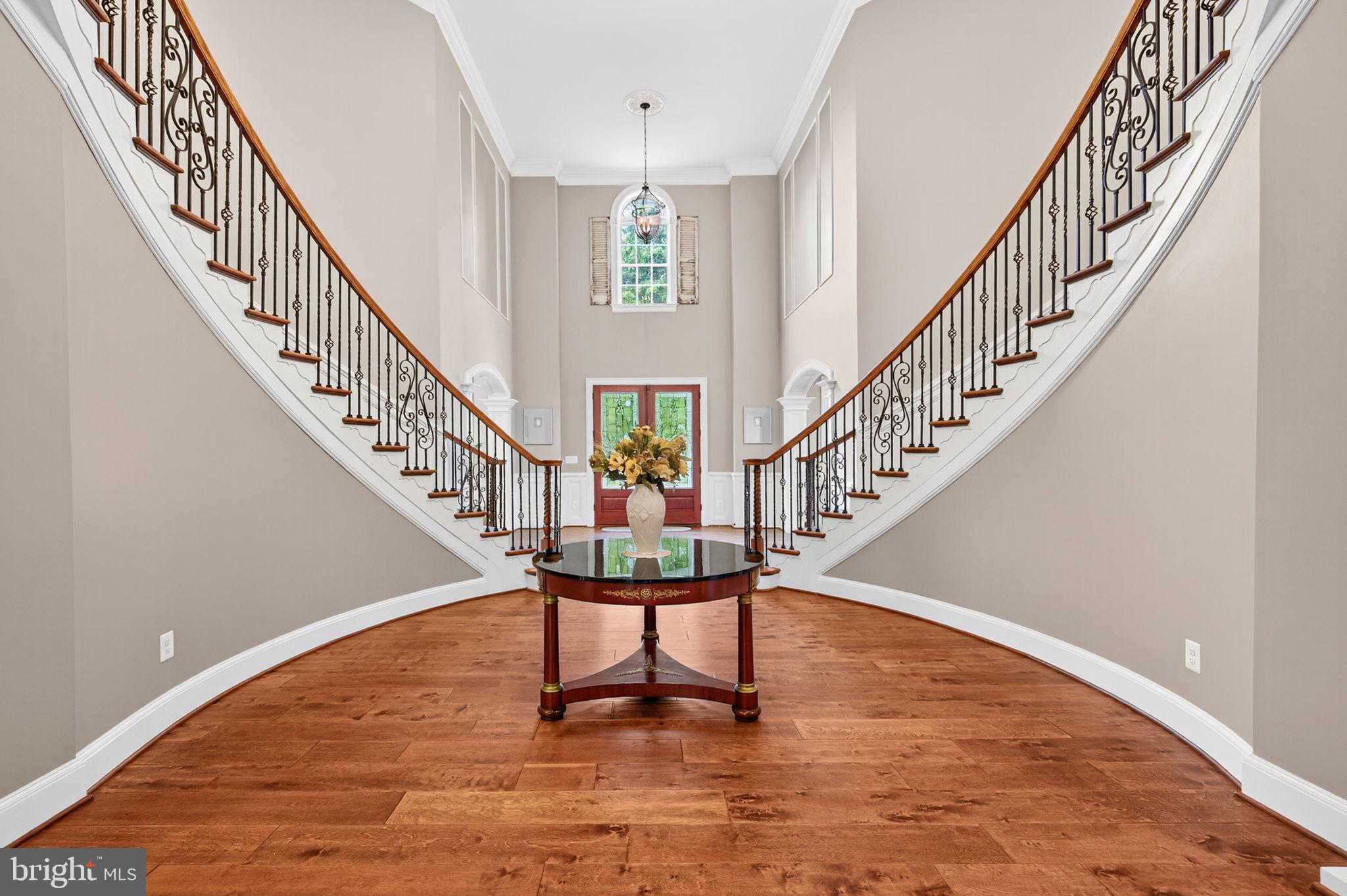 22011 Beaverdam Drive Ashburn, VA 20148 - Photo 19 of 106 Elegant foyer with grand staircase allure.