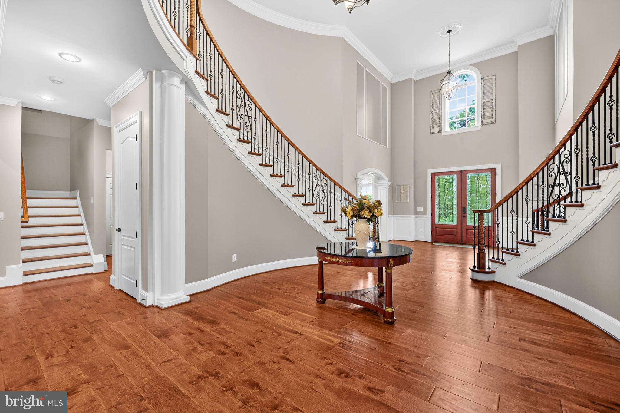 22011 Beaverdam Drive Ashburn, VA 20148 - Photo 20 of 106 a view of entryway dining room and hall with wooden floor