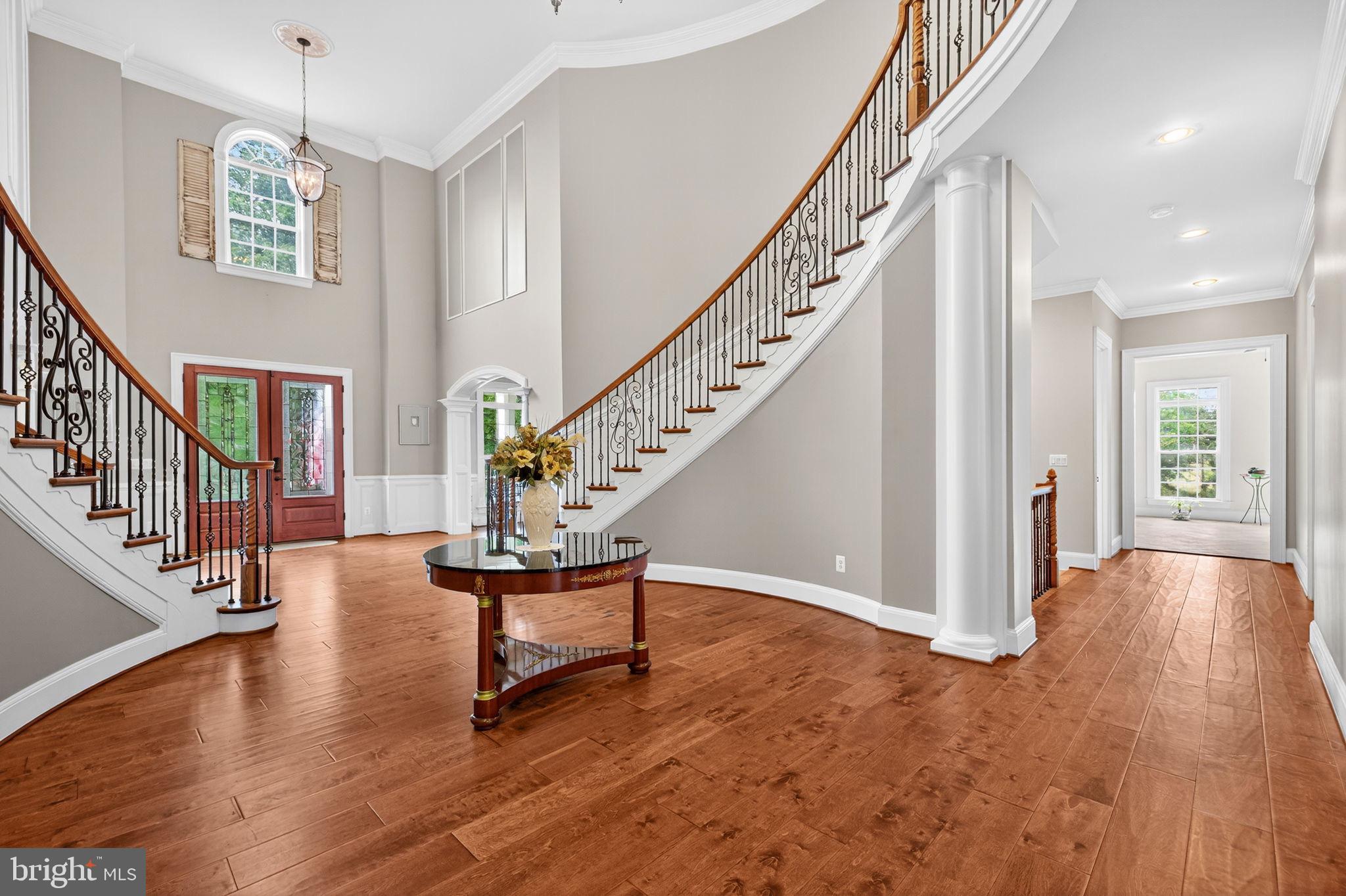 22011 Beaverdam Drive Ashburn, VA 20148 - Photo 21 of 106 a view of entryway with wooden floor and stairs