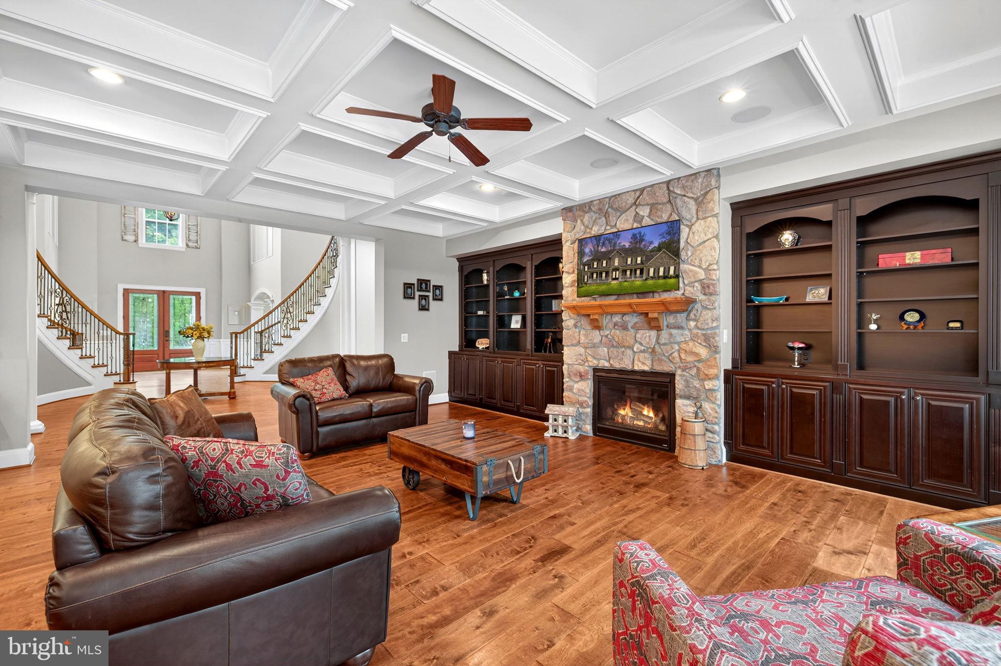 22011 Beaverdam Drive Ashburn, VA 20148 - Photo 27 of 106 a living room with furniture and a fireplace