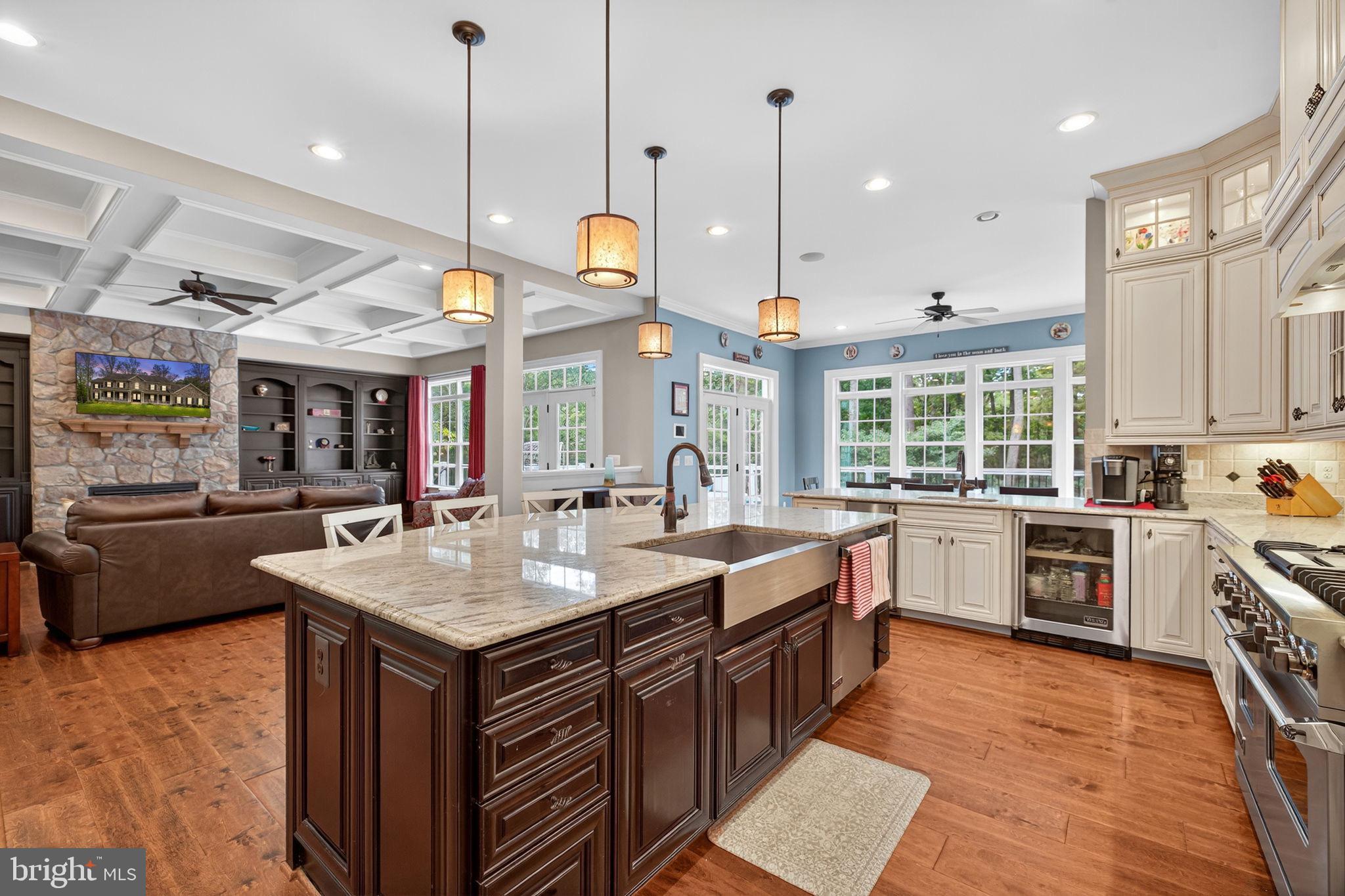 22011 Beaverdam Drive Ashburn, VA 20148 - Photo 30 of 106 a kitchen with stainless steel appliances granite countertop a sink a stove and a wooden floors