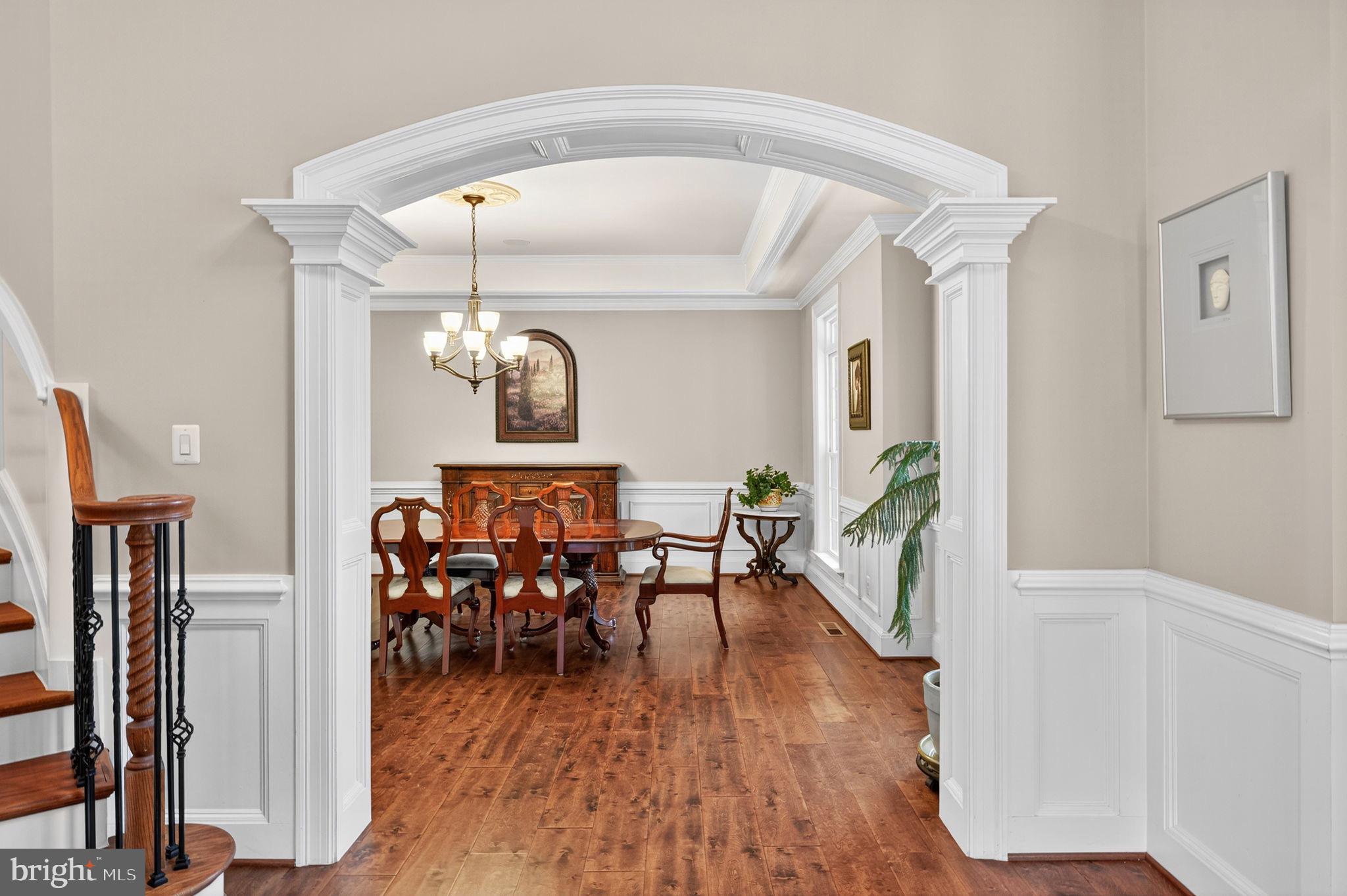 22011 Beaverdam Drive Ashburn, VA 20148 - Photo 42 of 106 a view of a dining room with furniture window and wooden floor