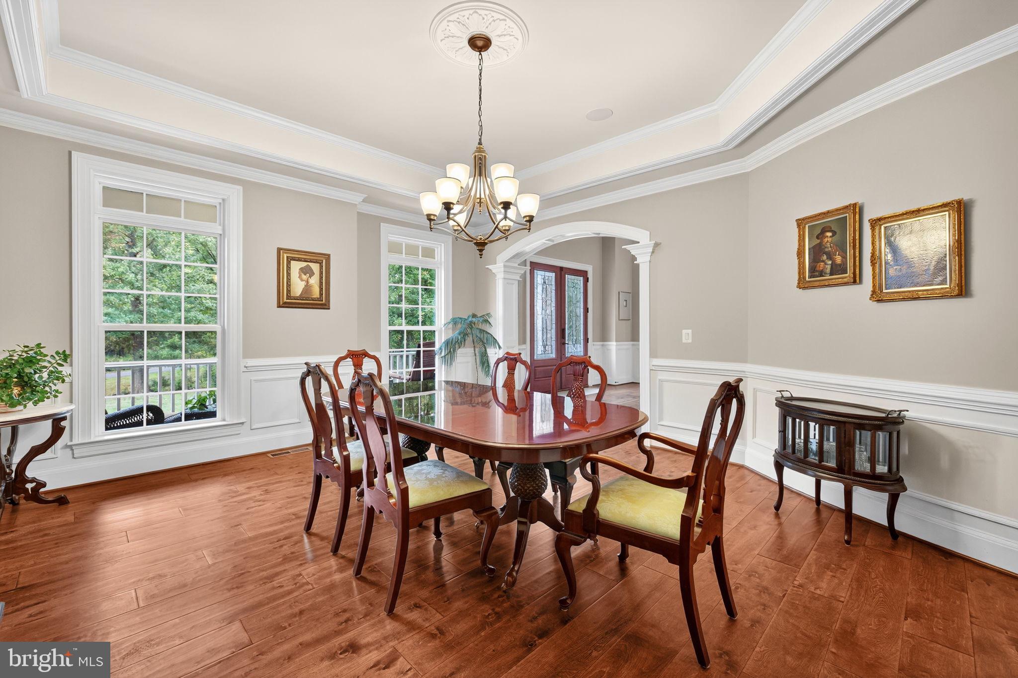 22011 Beaverdam Drive Ashburn, VA 20148 - Photo 49 of 106 a view of a dining room with furniture window and wooden floor