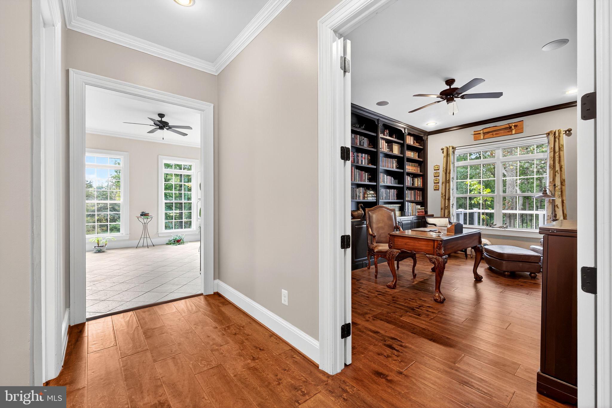 22011 Beaverdam Drive Ashburn, VA 20148 - Photo 52 of 106 a view of a livingroom with furniture hardwood floor and a ceiling fan