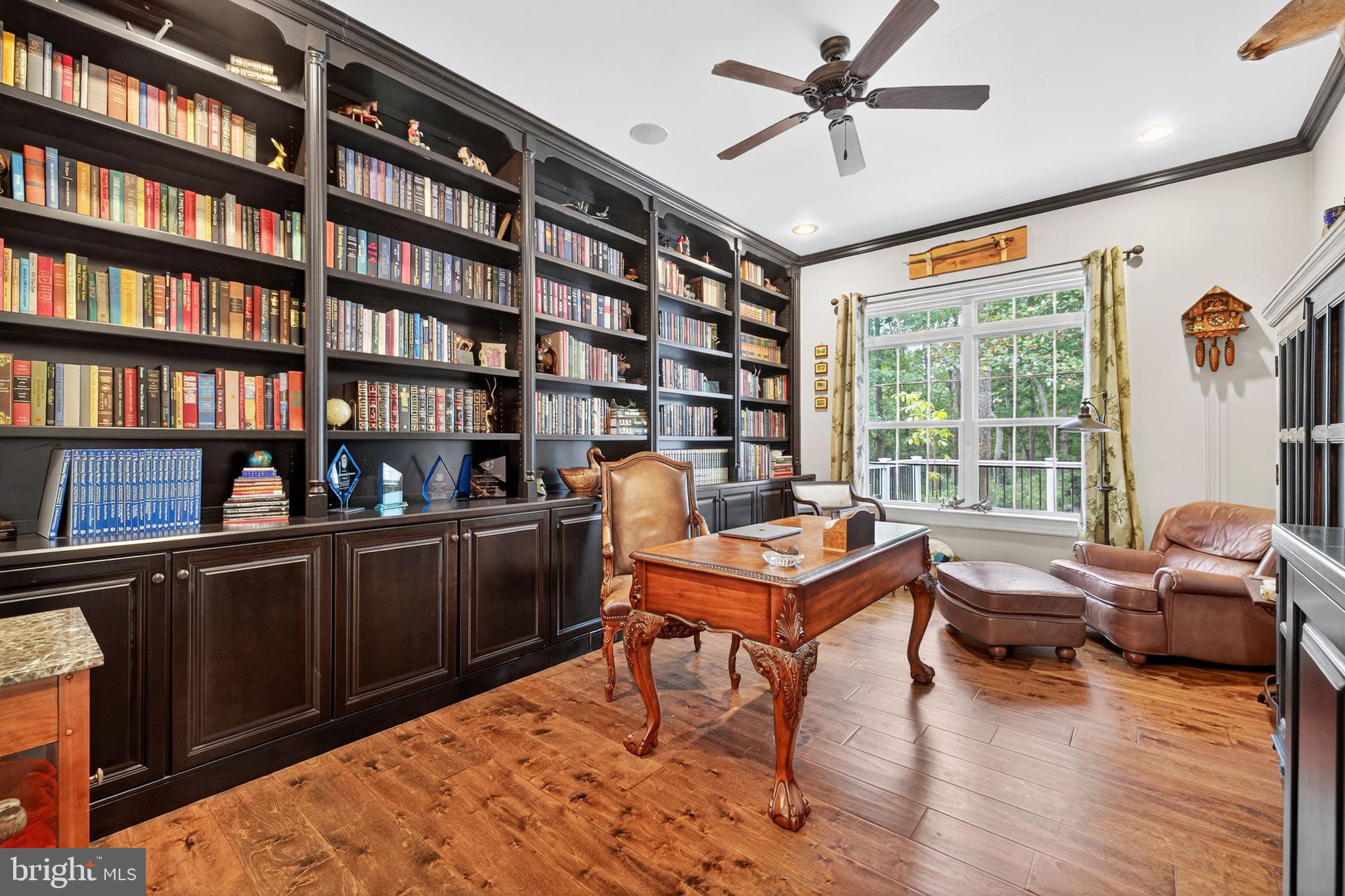 22011 Beaverdam Drive Ashburn, VA 20148 - Photo 53 of 106 Rich, wood built-in shelves in office.