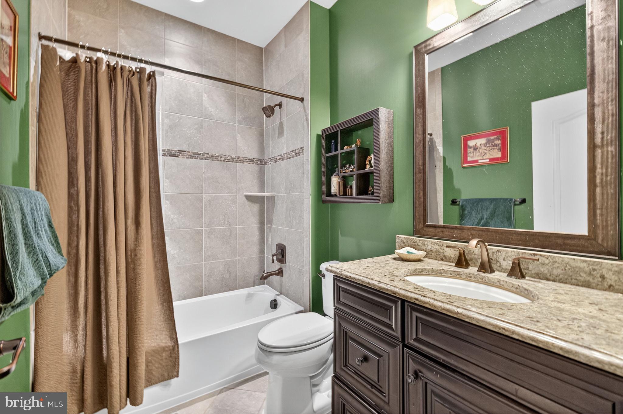 22011 Beaverdam Drive Ashburn, VA 20148 - Photo 61 of 109 Chic bathroom with vibrant green accents.