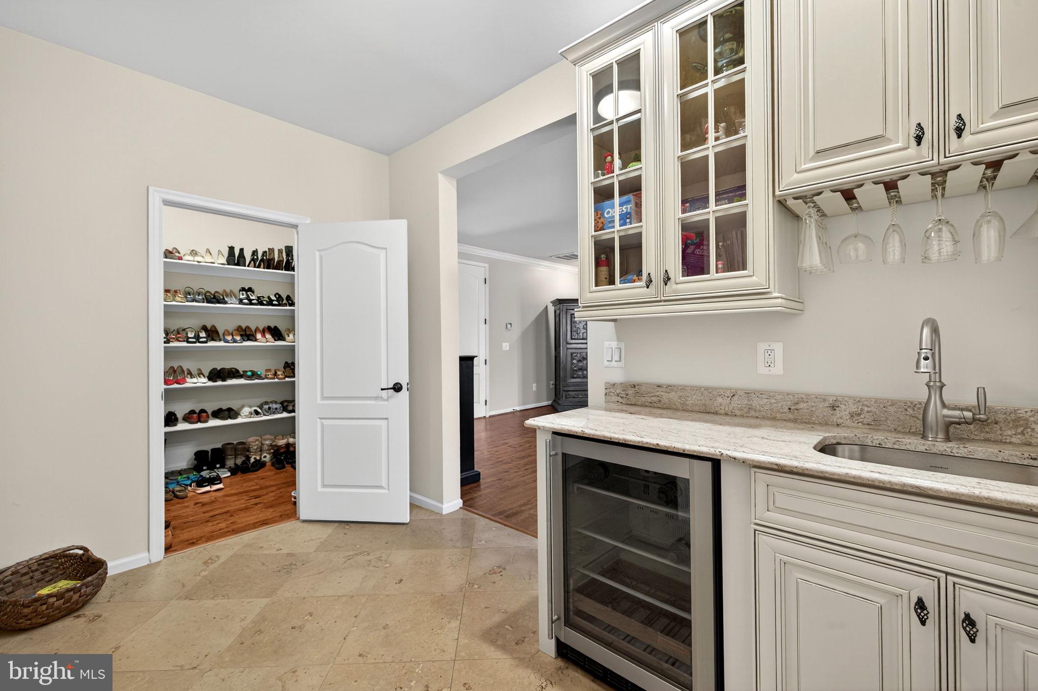 22011 Beaverdam Drive Ashburn, VA 20148 - Photo 69 of 109 Elegant pantry with stylish storage solutions.
