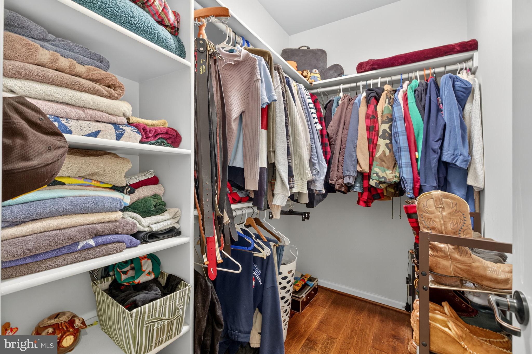 22011 Beaverdam Drive Ashburn, VA 20148 - Photo 71 of 106 a view of walk in closet with clothes