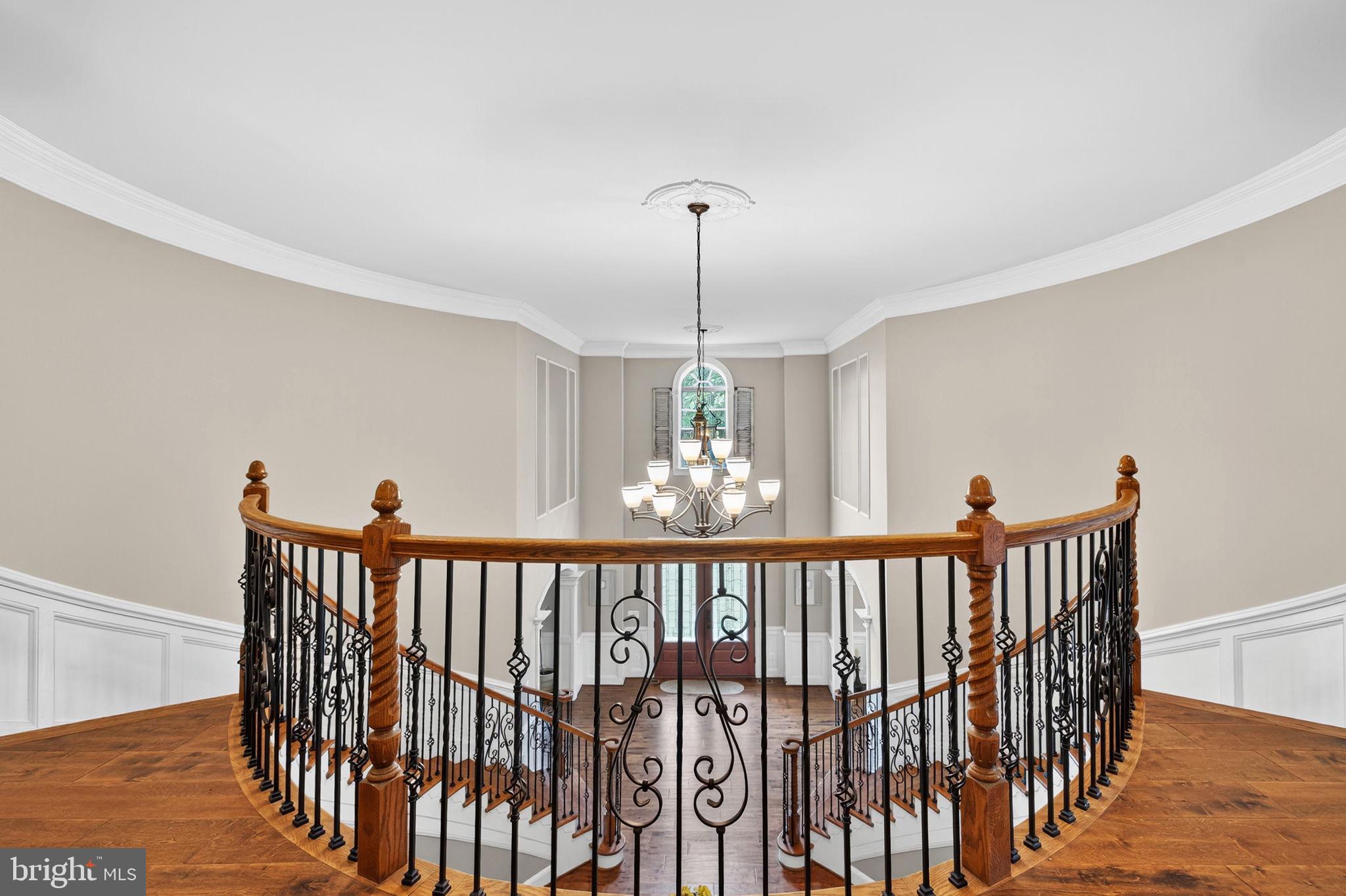 22011 Beaverdam Drive Ashburn, VA 20148 - Photo 72 of 106 Elegant staircase with stunning chandelier.